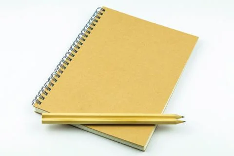 Close notebook with pencil on white background Foto stock