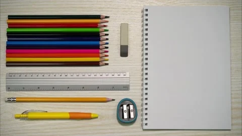 Close up of notebook, pencils and school materials with copy space Video stock 264156475