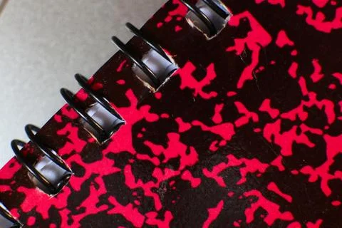 Close up of a notebook with a red and black camouflage pattern design 写真素材