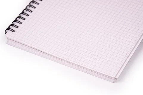 Close-up notebook with spiral binding, grid lines on pages, diagonal composit Stock Photos