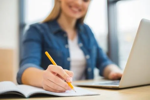 Close up of noted being take Stock Photos