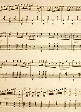 Close up of notes on an old music sheet. Photos