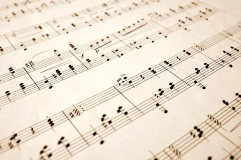 Close up of notes on an old sheet of music with shallow focus. Stock Photos