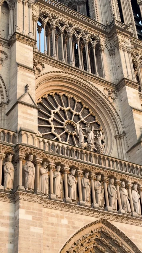 Close Up of Notre Dame Cathedral Facade Showing Rose Window and Stone Statues Stock Footage 340287932