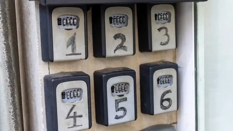 Close Up of Numbered Key Lock Boxes with Combination Codes Stock Photos