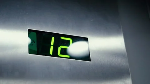Close up numbers of floor changing on screen during elevator lift up Video stock 214542939