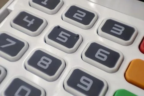 Close-up of a numeric keypad showing numbers 0-9 with highlighted buttons. Ideal 스톡 사진