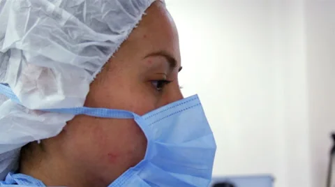 CLOSE UP. Nurse face during surgery. Stock Footage 51336947