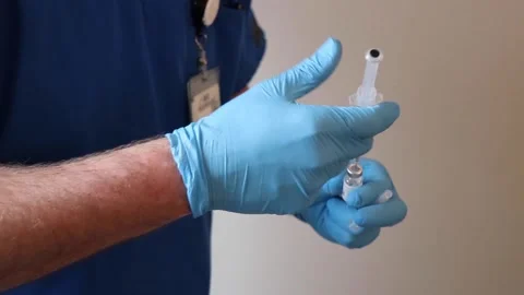 Close up of nurse filling a needle Stock Footage