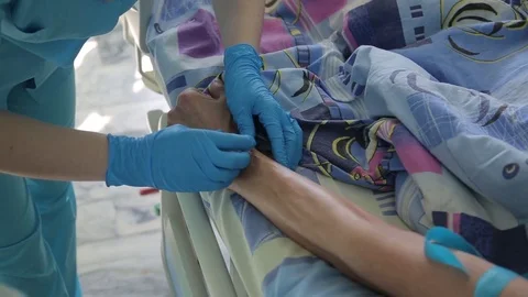 Close-up. A nurse sets up a catheter for a dropper Stock Footage 79263210