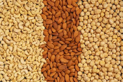 Close-up of nuts background: cashews, hazelnuts, almonds. Healthly food. A Stock Photos