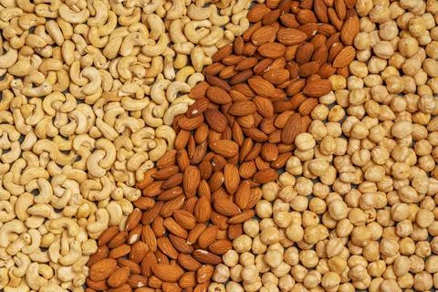 Close-up of nuts background: cashews, hazelnuts, almonds. Healthly food. A Stock Photos