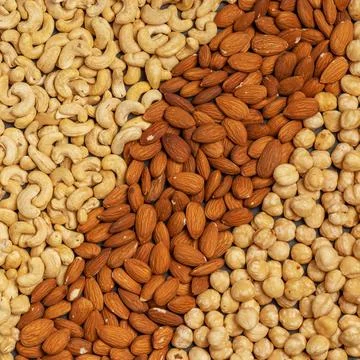 Close-up of nuts background: cashews, hazelnuts, almonds. Healthly food. A 写真素材