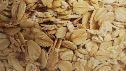 Close up of oat grains texture. Detailed view of dry oatmeal, natural food Stock Footage 334719599