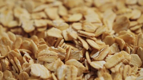 Close up of oat grains texture. Detailed view of dry oatmeal, natural food Stock Footage 334719658