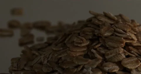 Close-up of an oatmeal pile with a moving light Stock Footage 152762858
