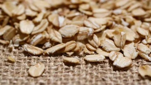 Close-up oatmeal texture, closeup oat flakes, vegetarian healthy food background 스톡 동영상 201127495
