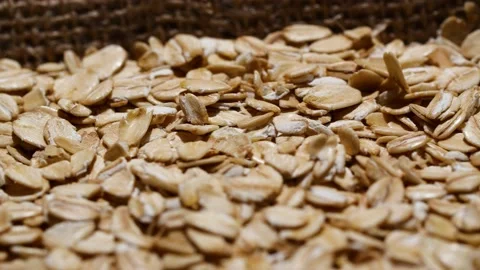 Close-up oatmeal texture, closeup oat flakes, vegetarian healthy food background Stockbeeldmateriaal 201317863