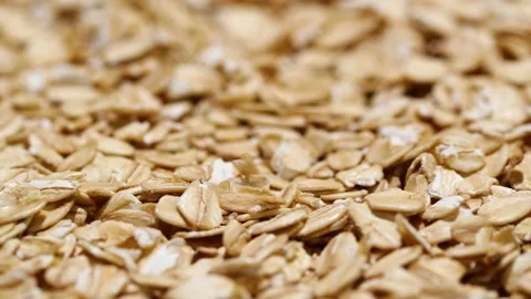 Close-up oatmeal texture, closeup oat flakes, vegetarian healthy food background Stock Footage 201838840