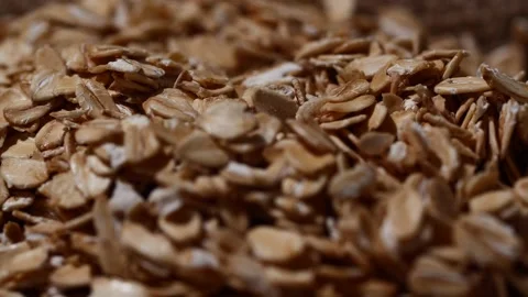 Close-up oatmeal texture, macro oat flakes, vegetarian healthy food background Stockbeeldmateriaal 203995453