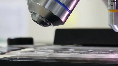 Close up on objective lens of microscope in laboratory. Stock Footage 79293811
