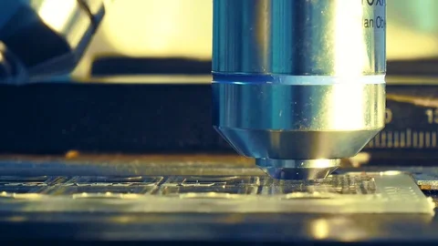 Close up on objective lens of microscope in laboratory. Stock Footage 79296557