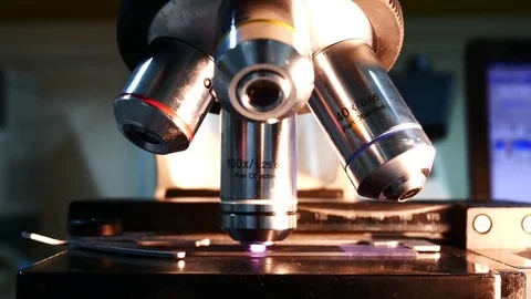 Close up on objective lens of microscope in laboratory. Stock Footage 79297525