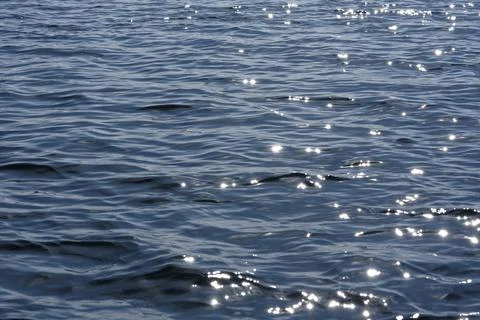 Close up of the ocean in motion in the sunlinght Stock Photos