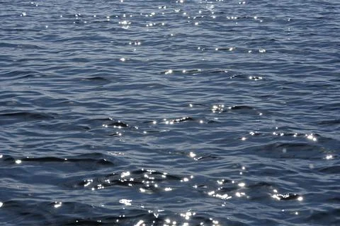 Close up of the ocean in motion in the sunlinght Stock Photos