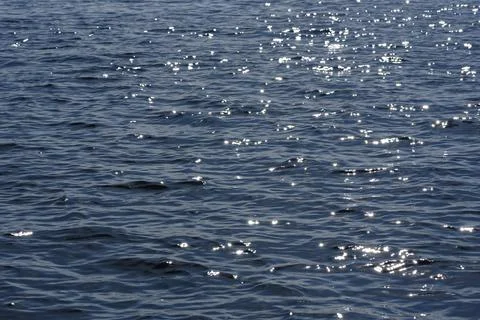 Close up of the ocean in motion in the sunlinght Stock Photos