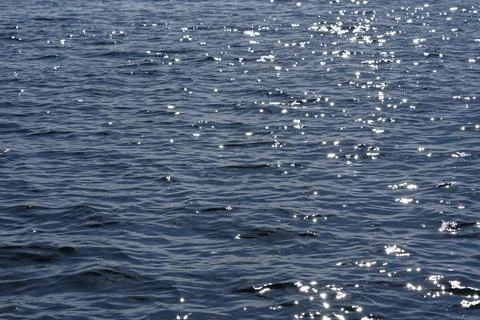 Close up of the ocean in motion in the sunlinght Stock Photos