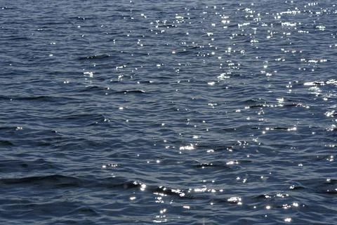 Close up of the ocean in motion in the sunlinght Stock Photos