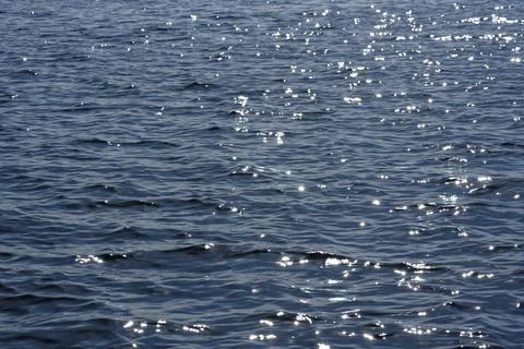 Close up of the ocean in motion in the sunlinght Stock Photos