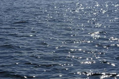Close up of the ocean in motion in the sunlinght Stock Photos