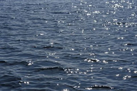 Close up of the ocean in motion in the sunlinght Stock Photos