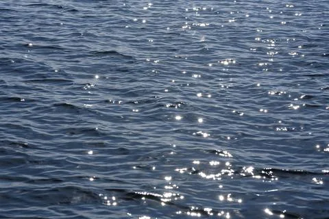 Close up of the ocean in motion in the sunlinght Stock Photos