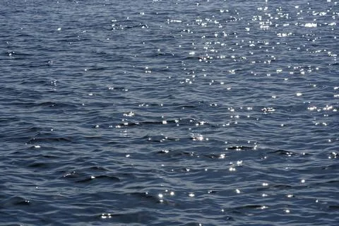 Close up of the ocean in motion in the sunlinght Stock Photos
