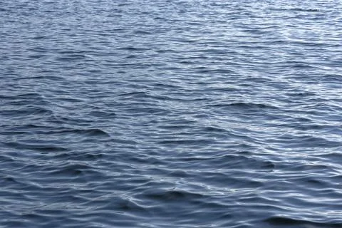 Close up of the ocean in motion in the sunlinght Stock Photos