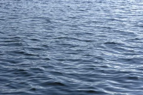 Close up of the ocean in motion in the sunlinght Stock Photos