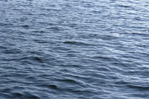 Close up of the ocean in motion in the sunlinght Stock Photos