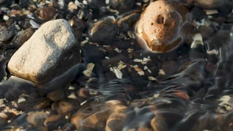 Close up of ocean water on rocky beach Stock Footage 249207593