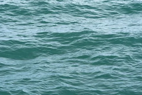 A close-up of the ocean wave surface wallpaper in the sunlight Stock Photos