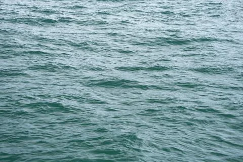 A close-up of the ocean wave surface wallpaper in the sunlight Stock Photos