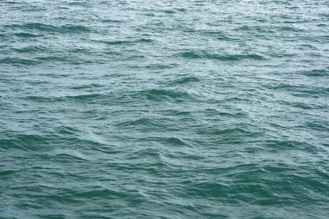 A close-up of the ocean wave surface wallpaper in the sunlight Stock Photos