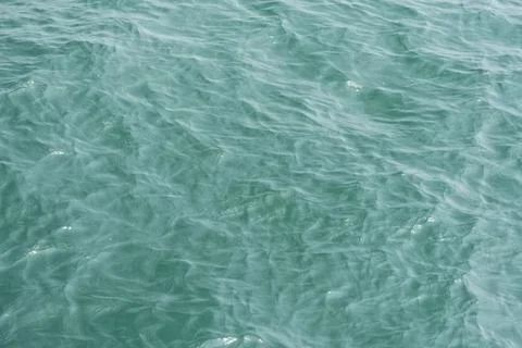 A close-up of the ocean wave surface wallpaper in the sunlight Stock Photos