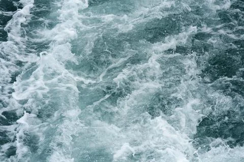 A close-up of the ocean wave surface wallpaper in the sunlight Stock Photos