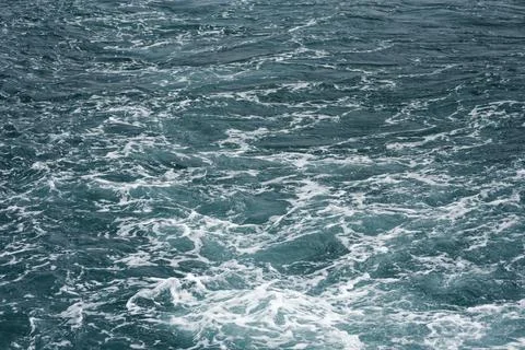 A close-up of the ocean wave surface wallpaper in the sunlight Stock Photos