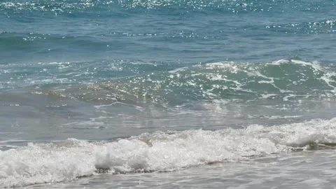 Close up of ocean waves crashing on beach with white seafoam. Surf tropical Stock Footage 341544057