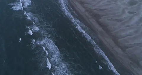 Close up of ocean waves rolling into a beautiful beach at sunset Stock Footage 201061458