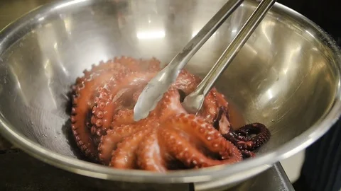Close up of octopus cooked in a pan Stock Footage 75413912